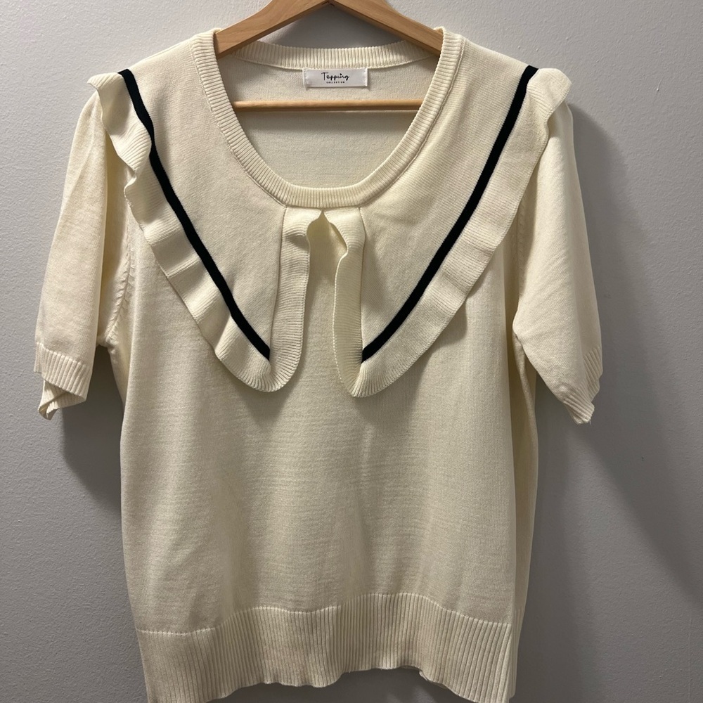 Cream Ruffled Top with Black Trim